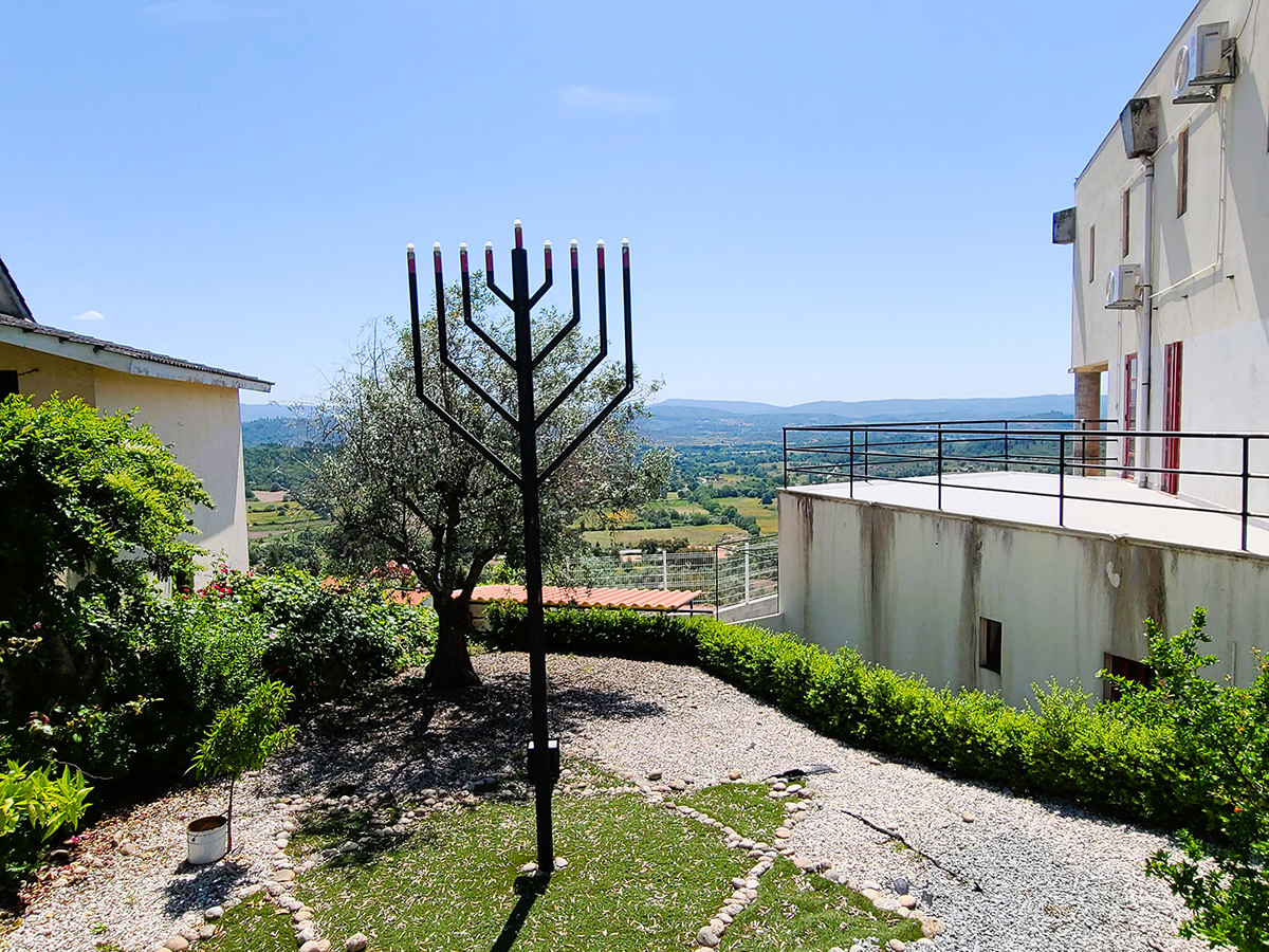 #15A. Insert AFTER ... Paragraph 19 AFTER...after the edict of expulsion proclaimed in 1497 ... TAG A Menorah stands proudly overlooking the valley below Belmonte.